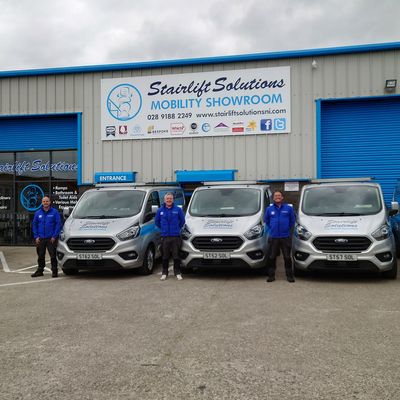 Stairlift Solutions team and vans at the mobility showroom, Derry